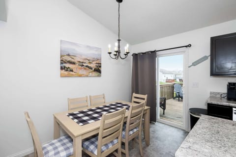 Gather for meals together at the dining table, offering seating for 6