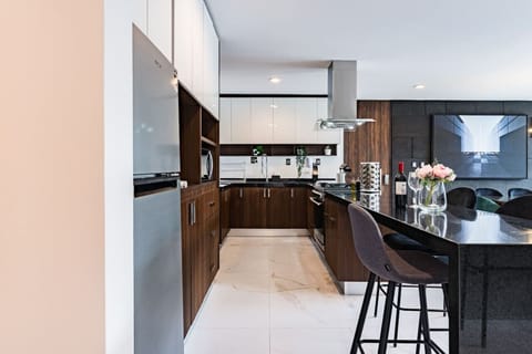Fully equipped kitchen with sleek cabinetry and premium appliances for gourmet meals.