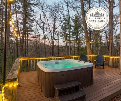 Your private forest retreat: a hot tub oasis illuminated by enchanting string lights.