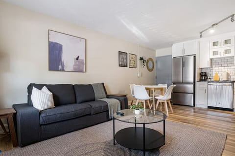 You feel at home as you settle into the living room, where the inviting atmosphere is perfect for lounging or entertaining.