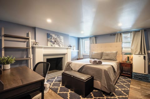 Queen bedroom features a desk, walk-in closet, and convenient washer & dryer.