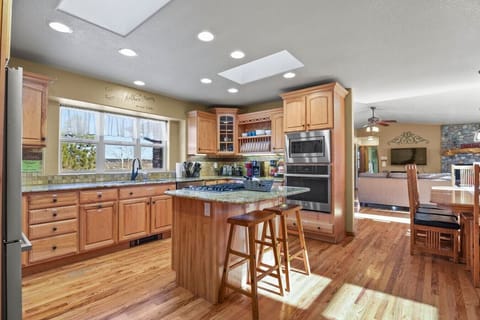 Well equipped kitchen with island and skylights