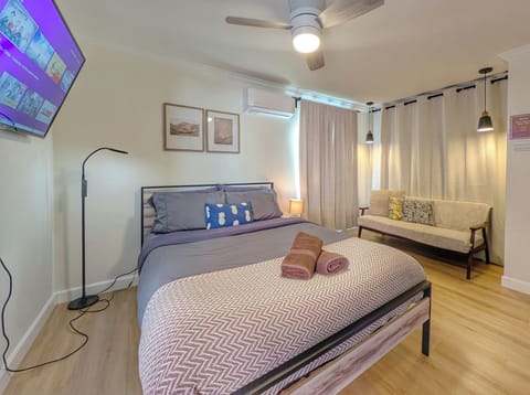 Relax in a stylish studio bed setup offering comfort and convenience.
