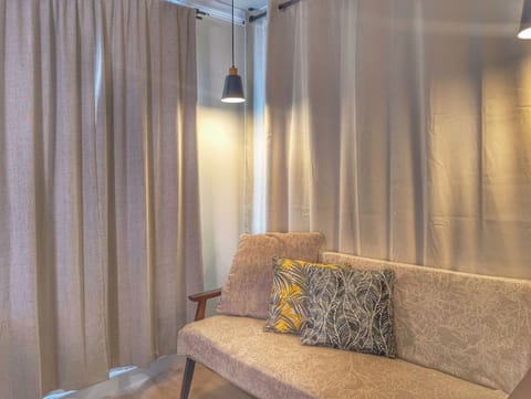 Cozy studio sofa adds a comfy lounge spot to your modern Monterey Park stay.