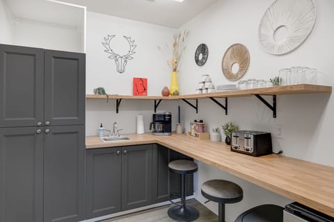 Bonus downstairs kitchenette — because one kitchen is never enough.