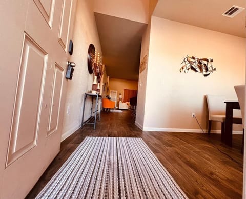 Entryway and Hallway: Modern and welcoming entryway with sleek flooring and stylish accents, offering a warm first impression as you prepare to explore nearby attractions like San Marcos Premium Outlets.