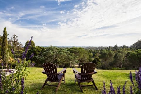 Unwind in Adirondack chairs with sweeping coastal views.