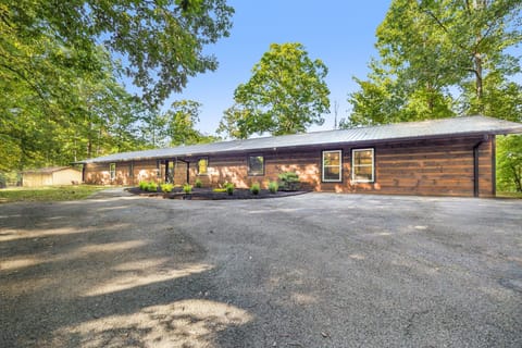 Spacious single-level cabin surrounded by lush forest views.