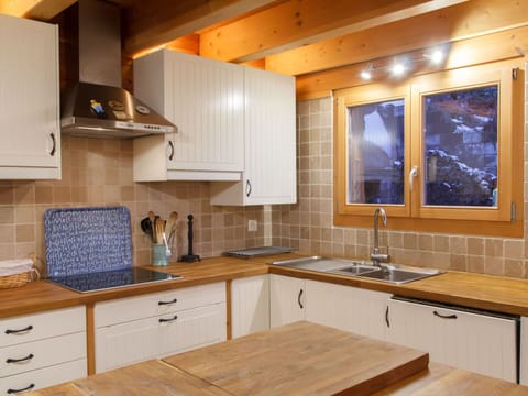 Kitchen, Countertop, Cabinetry, Kitchen Appliance, Furniture, Flooring, Interior Design, Wood, Major Appliance, Kitchen Sink