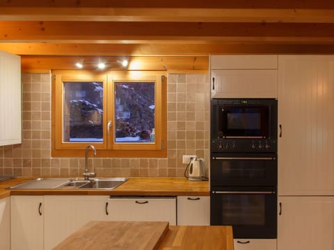 Kitchen, Countertop, Kitchen Appliance, Flooring, Furniture, Cabinetry, Interior Design, Major Appliance, Wood, Floor