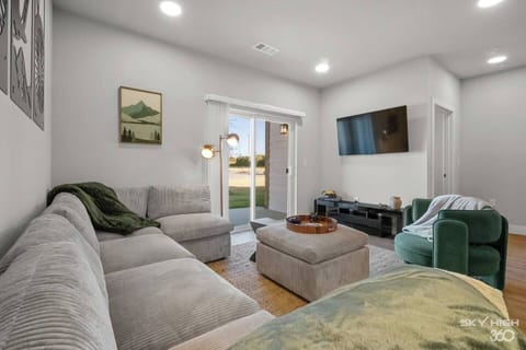 Step into the inviting open-concept living space, flooded with natural light. The contemporary decor and plush furnishings are perfect for relaxing after a day of exploring. Need extra space for sleeping this couch is perfect and can easily sleep 2.