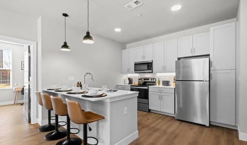 The fully equipped kitchen features sleek, modern appliances and ample counter space, making it easy to prepare your favorite meals. Whether you’re brewing a morning coffee or eating in. You will have everything you need to make your favorite meals.