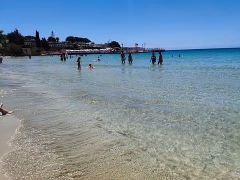 On the beach, sun loungers, beach towels