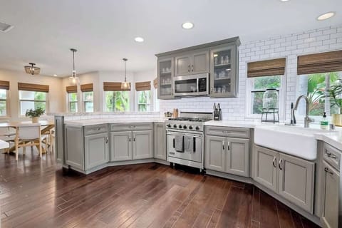 Fully stocked open chefs kitchen with tons of natural light 