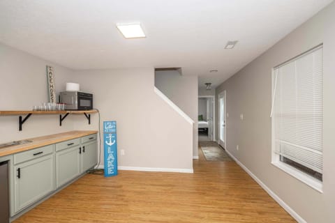 Game room with Smart TV, board games, wet bar, and deck
