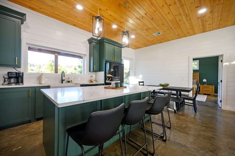 The chic, open kitchen offers ample space & all the comforts of home