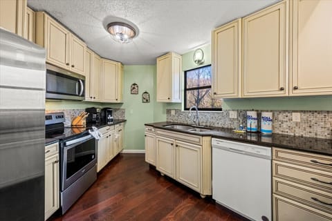 The fully equipped kitchen boasts modern appliances and everything you need for gourmet meals.