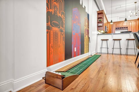 Enjoy some indoor fun with this mini putting green, set against vibrant local artwork. Perfect for a little friendly competition during your stay!