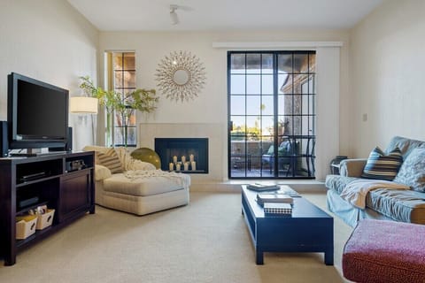 Cozy living room with smart TV, and multiple seating areas!