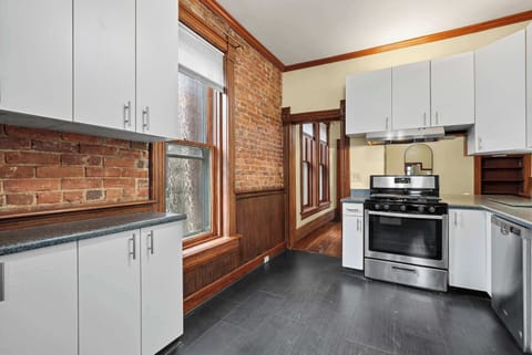 The airy kitchen offers ample space & every home comfort