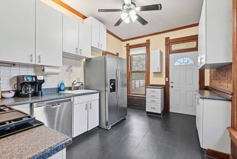 The airy kitchen offers ample space & every home comfort