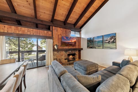 The living room 65inch TV. Fireplace in process of upgrade and not in use. New electric fireplace coming mid-January.