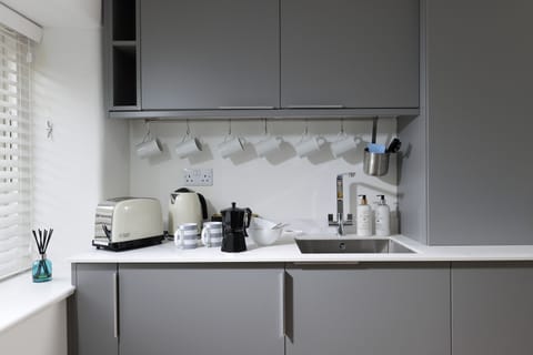 The kitchen offers a microwave, airfryer and stove top espresso maker