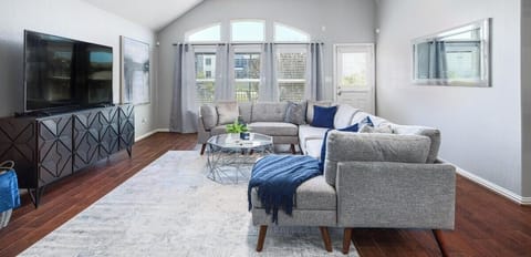 The living room boasts an open layout and elegant furnishings.