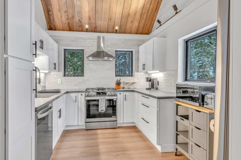 Kitchen: Keurig, kettle, toaster, cooking utensils, tableware