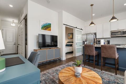 Designer decor makes this apartment feel both cozy and stylish! 