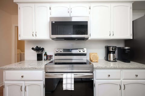 Featuring high-end appliances and ample cabinetry for all your culinary needs.