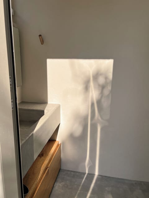 1/2 bath accessed outside of the house shared by both upstairs and downstairs.