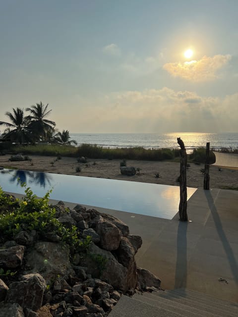 Olympic-sized shared pool. 8 lounge chairs and 3 umbrellas with shaded areas