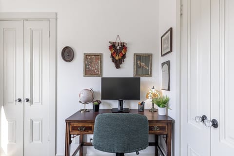 designated workspace in each bedroom w/ accessories to connect personal laptop