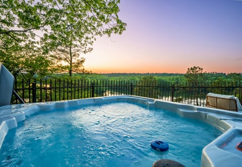 Enjoy a relaxing soak in the Hot Tub overlooking the lake.