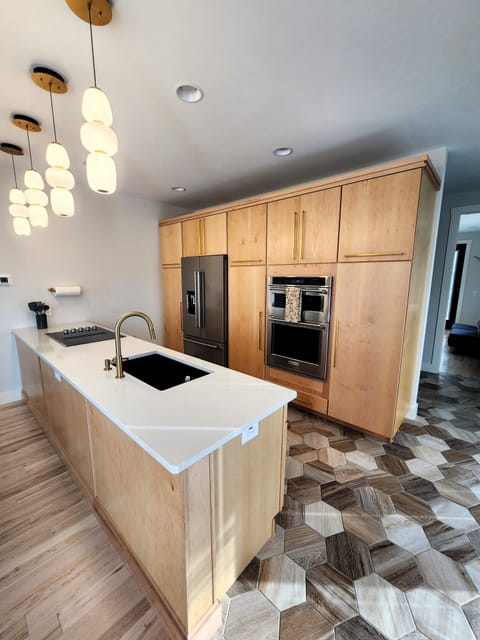 Fully stocked immaculate kitchen.