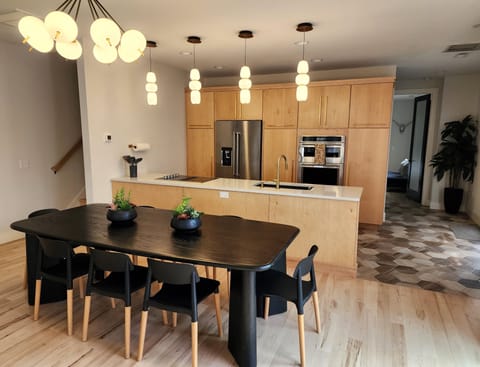 Open living space with large kitchen table.