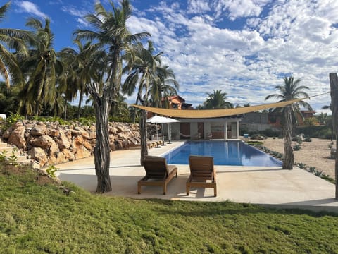 Pool and pool house with powder room and full outdoor kitchen