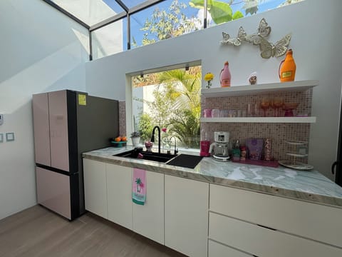 Pink Samsung Bespoke refrigerator with ice maker nuggets