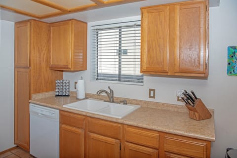 Kitchen with stove, microwave, fridge/freezer, dishwasher & disposal