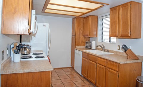 Kitchen with stove, microwave, fridge/freezer, dishwasher & disposal