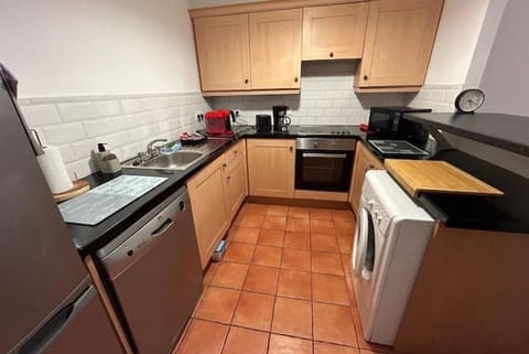 Fully equipped kitchen with coffee maker, fridge-freezer and dishwasher