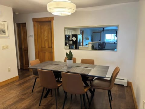 Large table seats 6-8 guests. Move bench from the living room for more seating.