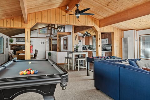 The great room is a hub of entertainment. Challenge friends to a competitive game of pool or foosball or gather around the table for a board game night.