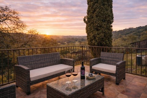 Cozy private patio with vineyard and hillside views.