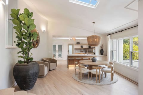 Share memorable meals in a sunlit dining space with designer charm.