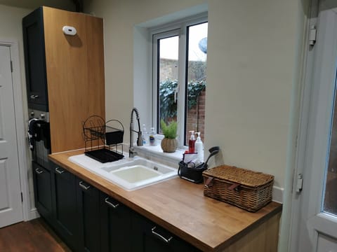 Kitchen showing oven and sink