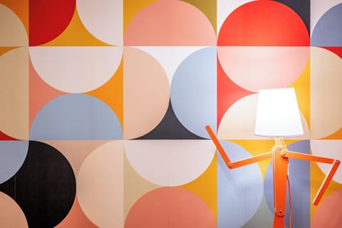 Color and style collide in a wall that sparks creativity.