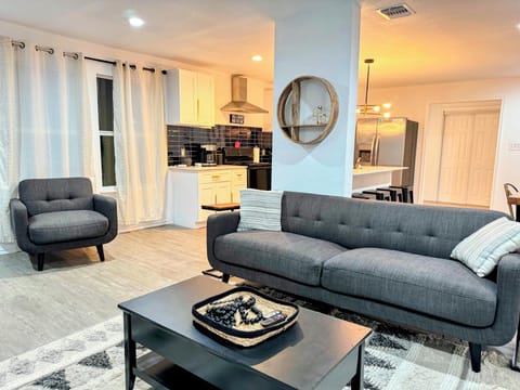 Guests love the spacious living room with comfy seating and a large TV!