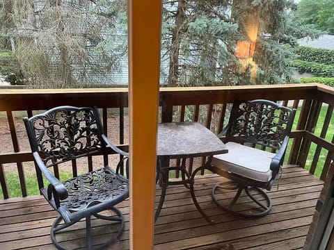 Balcony w/ Table and Two Chairs